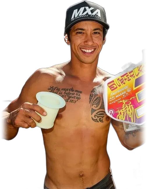 Brian Medeiros smiling on the podium in an MXA cap