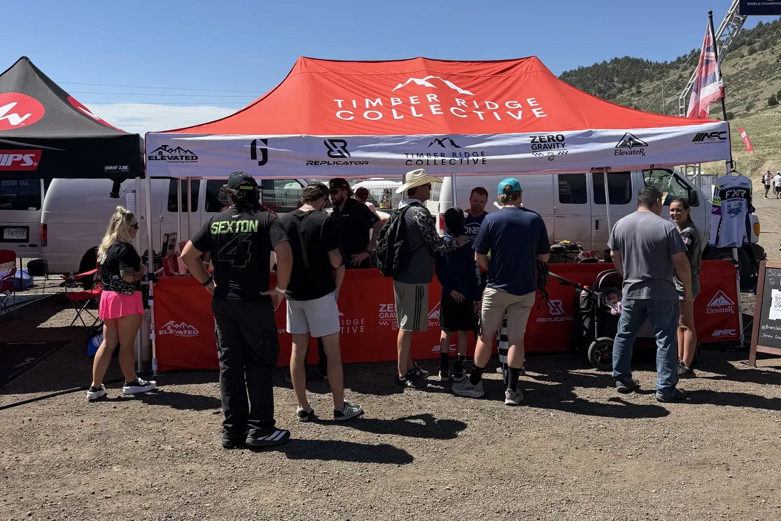 Riders and fans gathered at the Timber Ridge Collective tent on race day