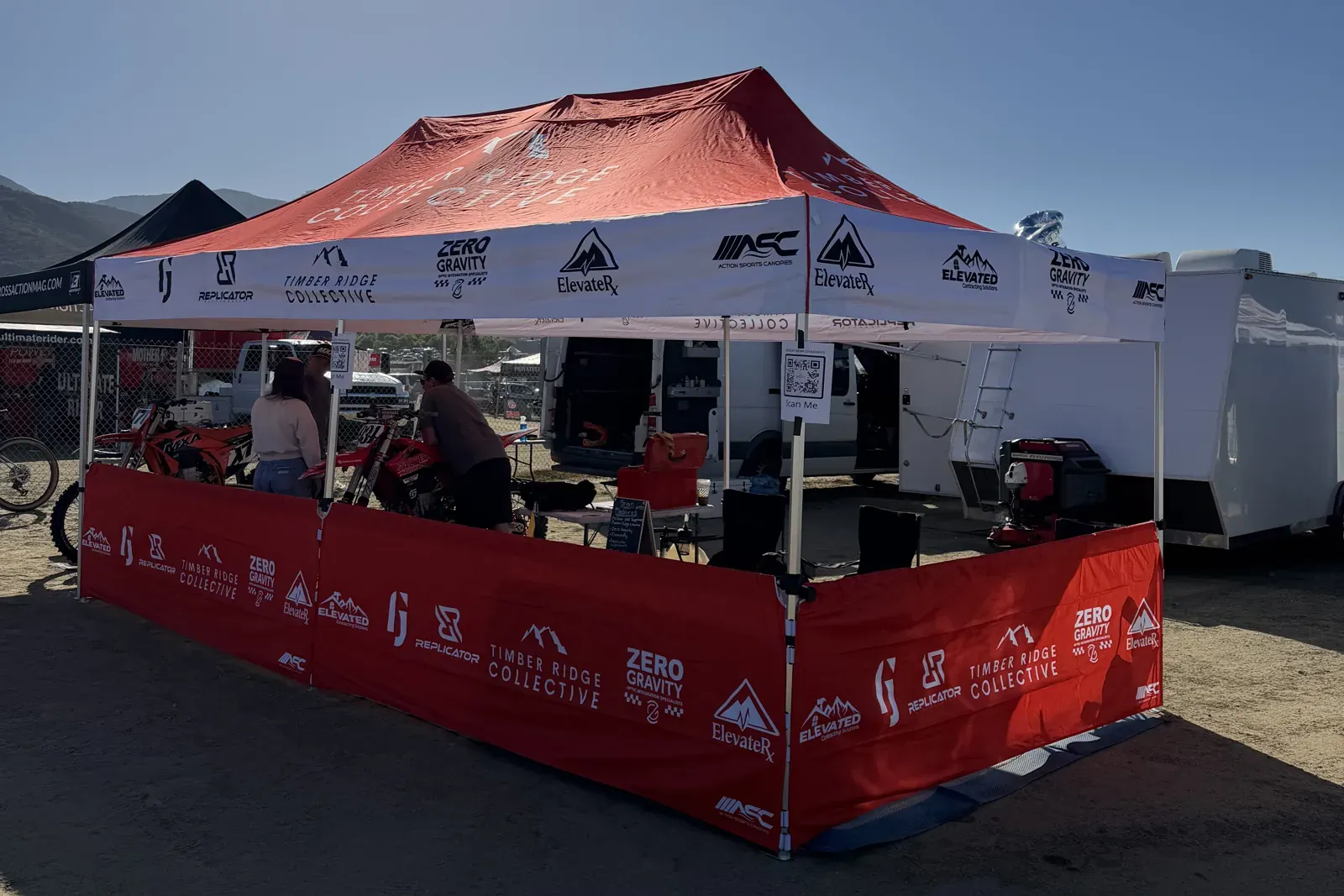 The Timber Ridge Collective tent and race bikes set up in the pits